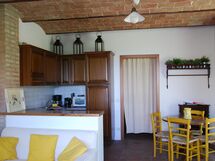 agriturismo-cabbiavoli-chianti-multiproperty-fienile-arancione-pero-living-room